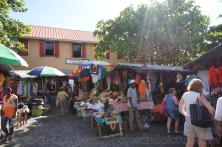 Tourists shop at the Craft Market in Roseau Dominica.jpg