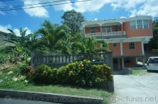 Two story salmon color home in Roseau Dominica.jpg