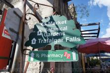 Attractions sign points to market Botanical Gardens and Trafalgar Falls in Roseau Dominica.jpg
