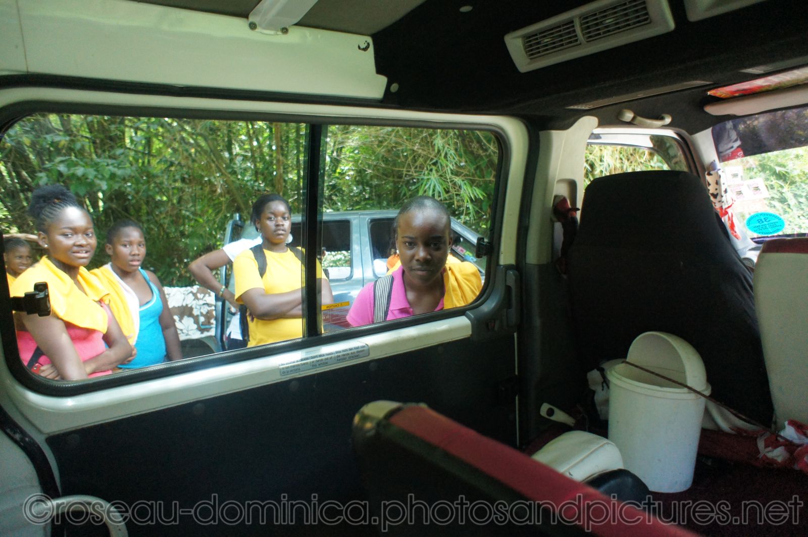 Girl students look inside tour van in Roseau Dominica.jpg