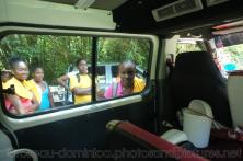 Girl students look inside tour van in Roseau Dominica.jpg