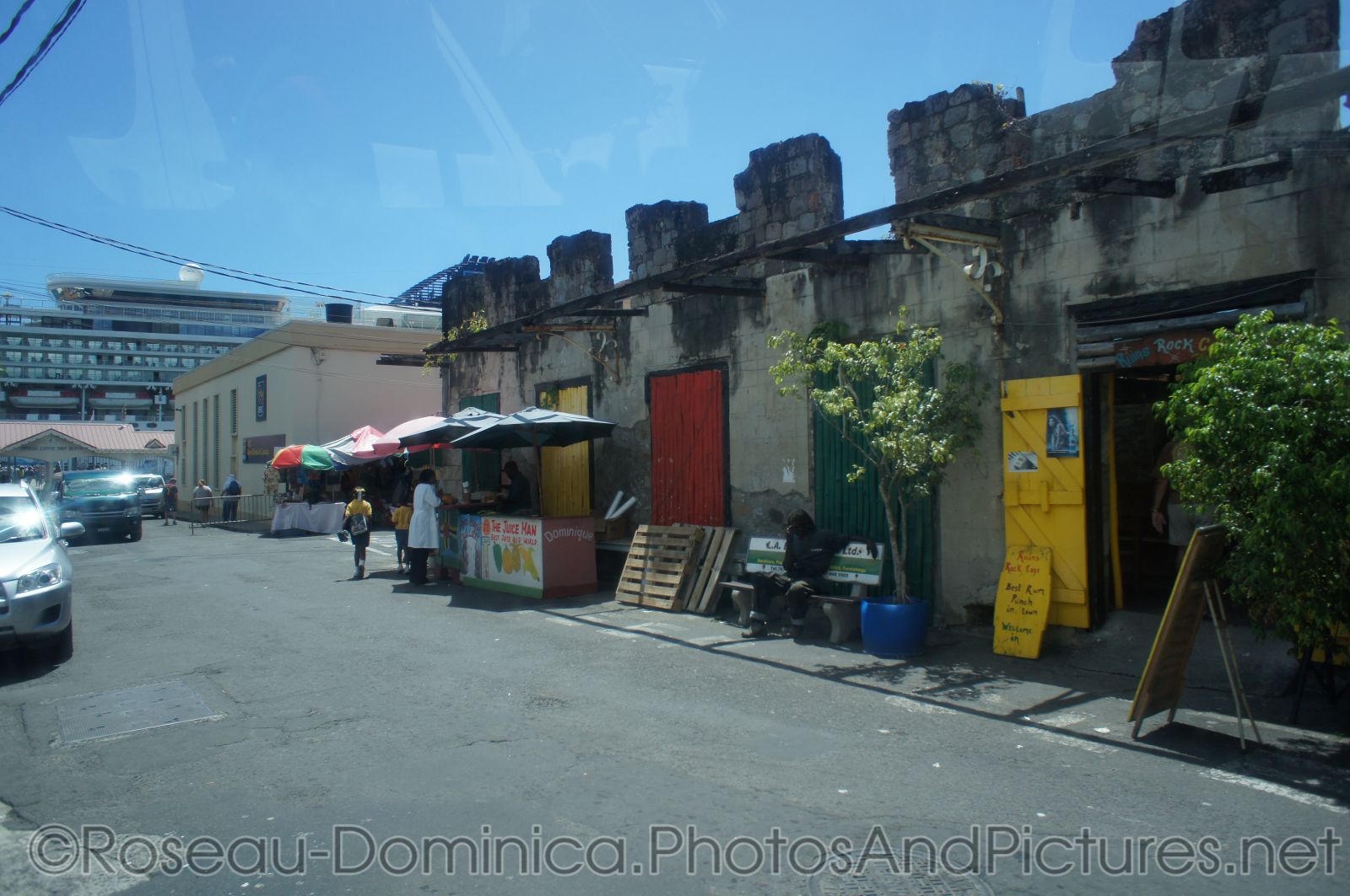 Vendors and juicestands in Roseau Dominica cruise port area.jpg